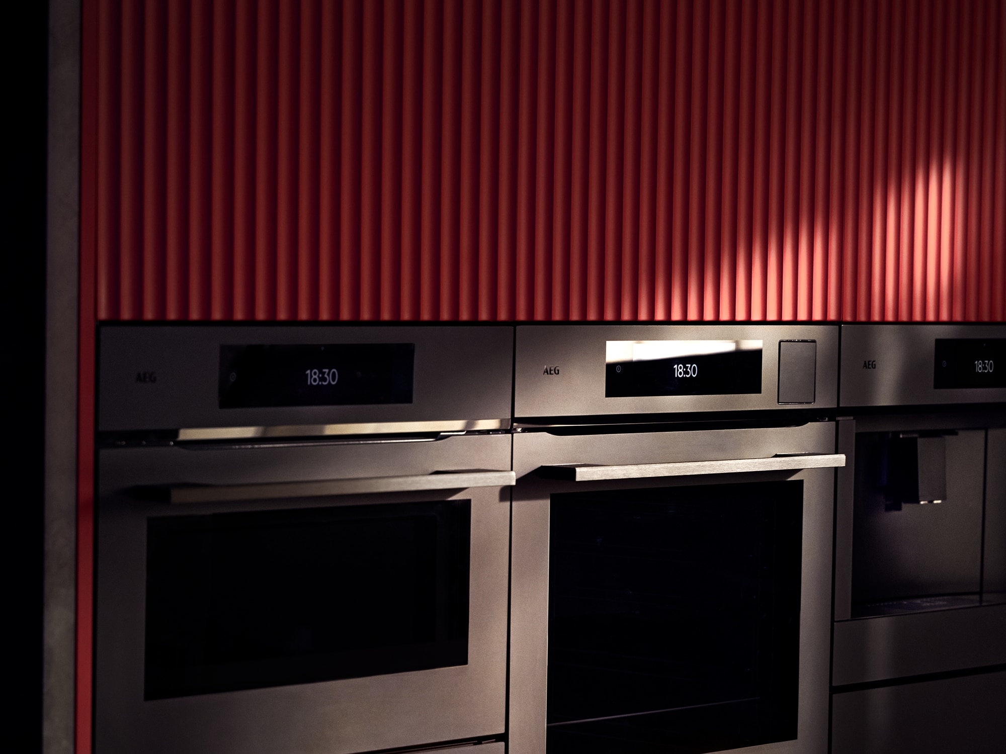 Man holding flowers in front of oven